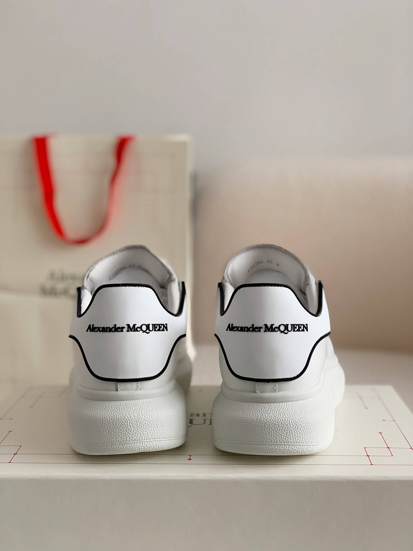 A1exa*der Mcqv*en MQ white film tail Sneakers