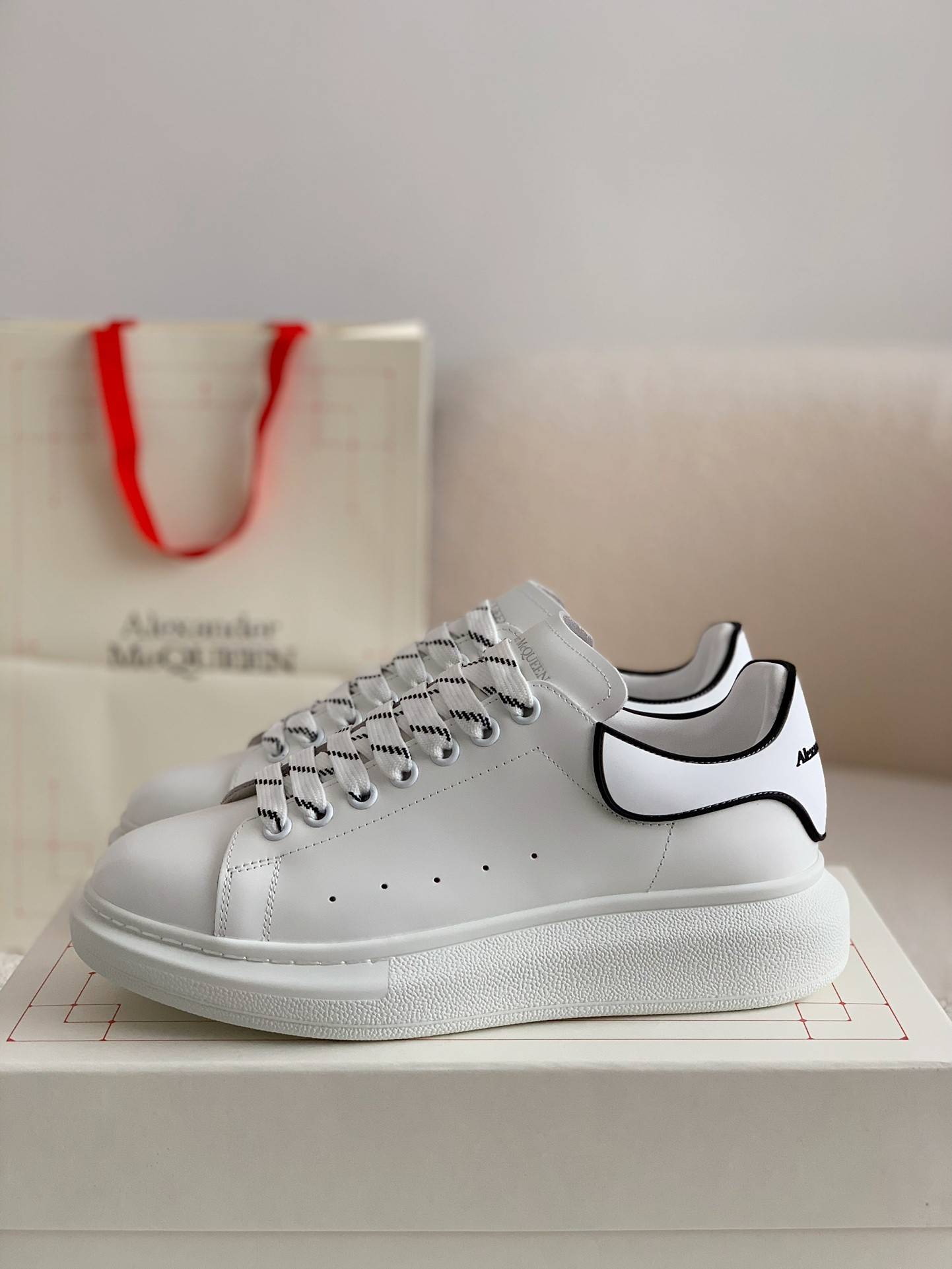 A1exa*der Mcqv*en MQ white film tail Sneakers